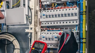 man-electrical-technician-working-switchboard-with-fuses
