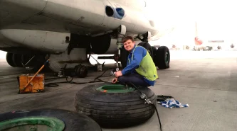 portrait-man-repairing-airplane