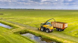 tractors-fresh-mowed-green-agricultural-grassland